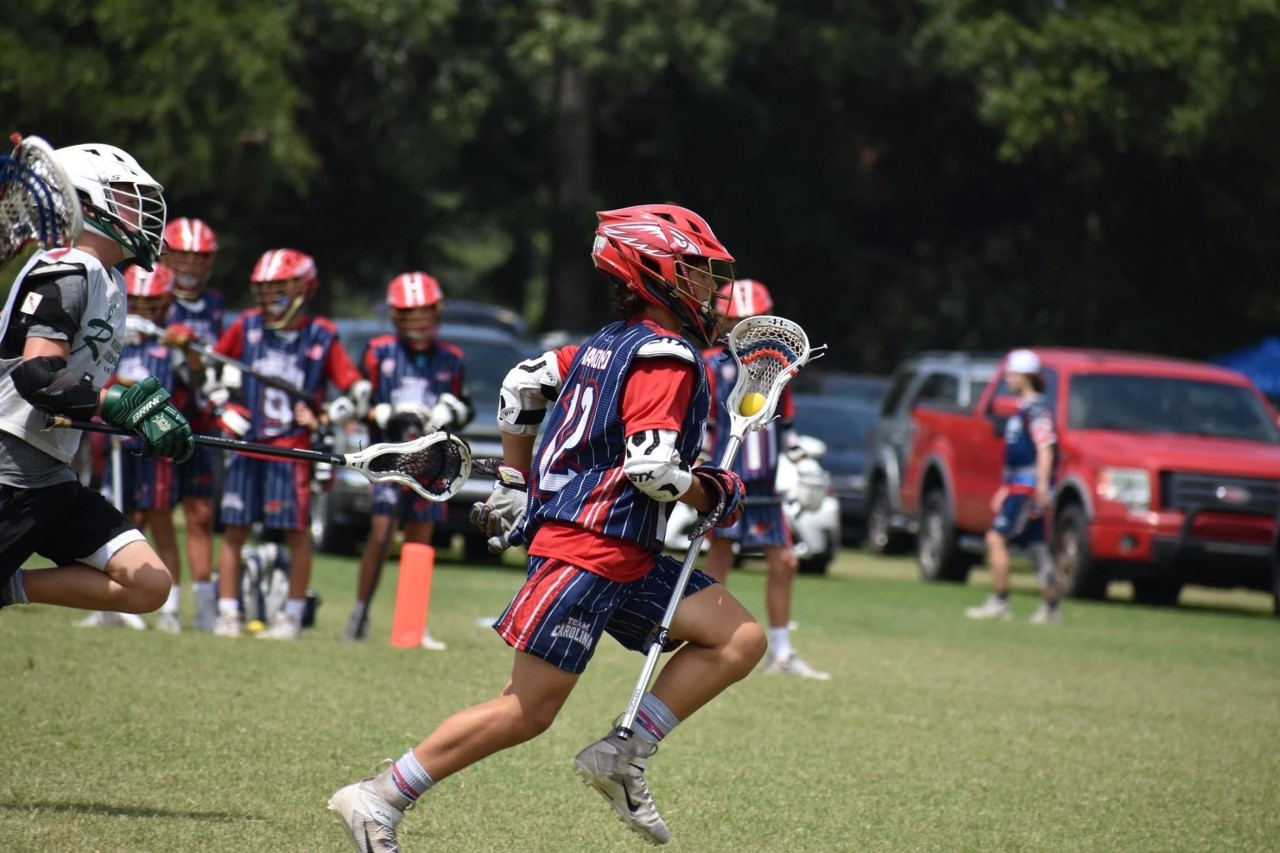 child exercising playing lacrosse lacrosse player in the game