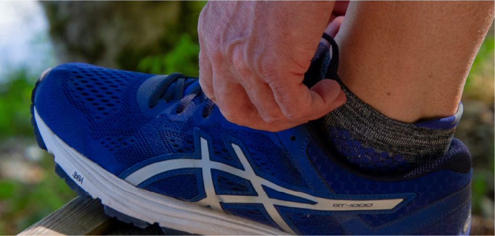 man tying his shoes