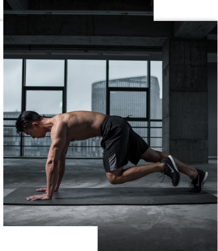 man doing planks inside the gym