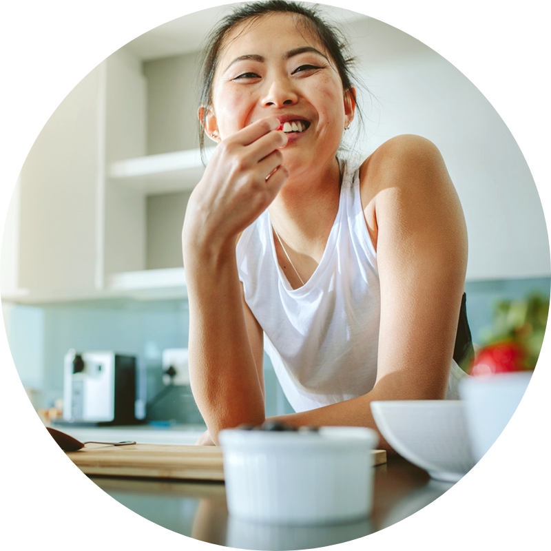 woman eating food to work on gaining healthy weight