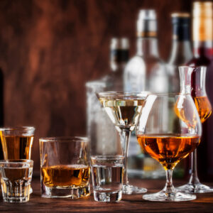 Hard alcoholic drinks in glasses in assortment