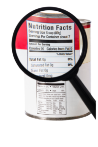 reading a food label with magnifying glass
