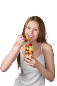 woman who planned ahead enjoys fruit cup at summer bbq