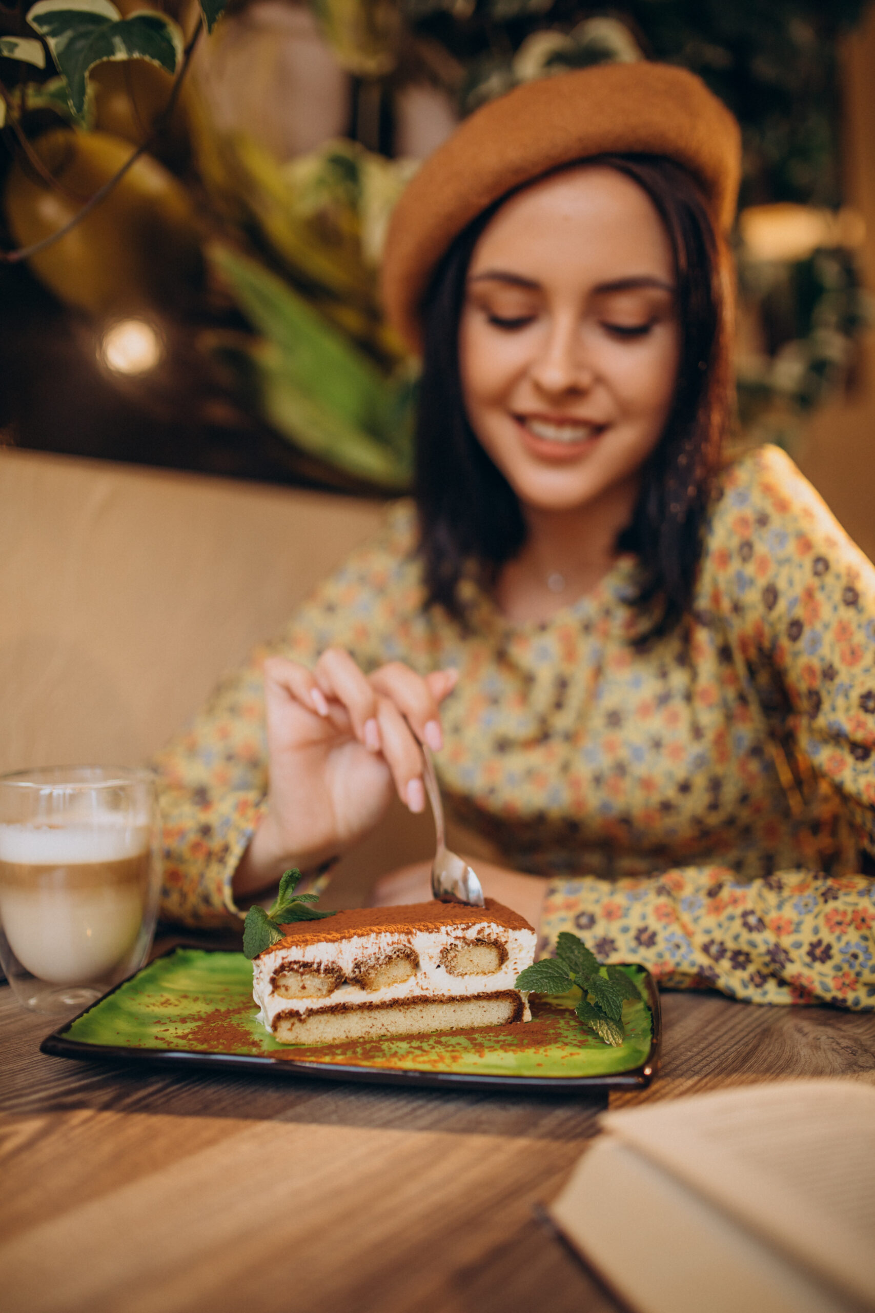 a girl eating a tiramisu cake