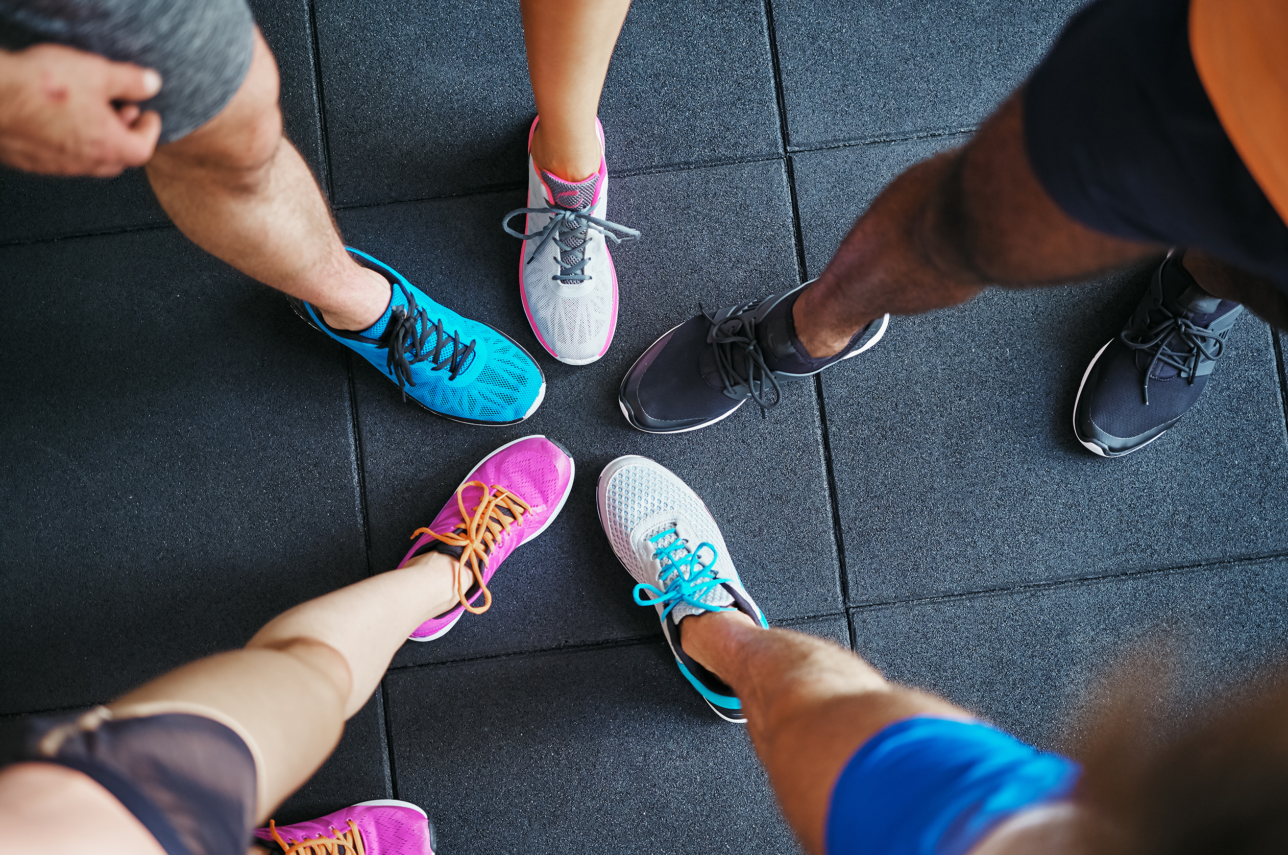 group of runners comparing shoes