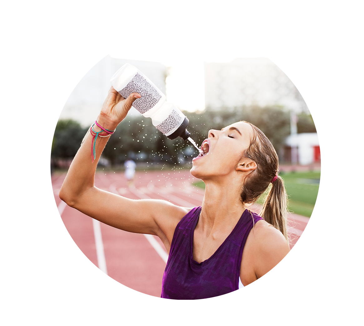 woman hydrating on track listening to her sports nutrition guidance from dietitian