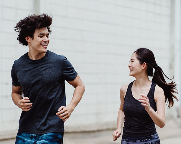 couple making fitness fun with jogging together
