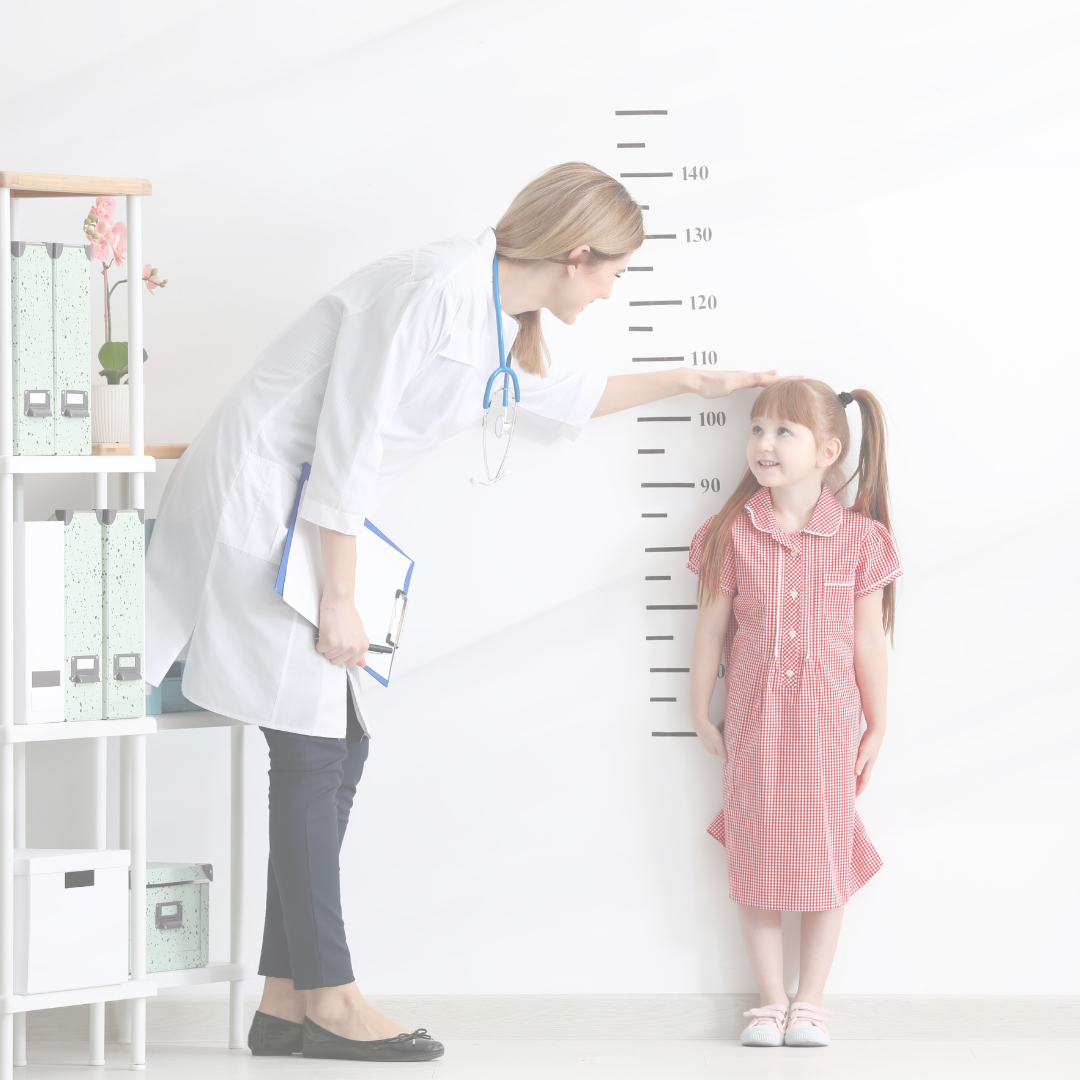 nutritionist measuring girl's height