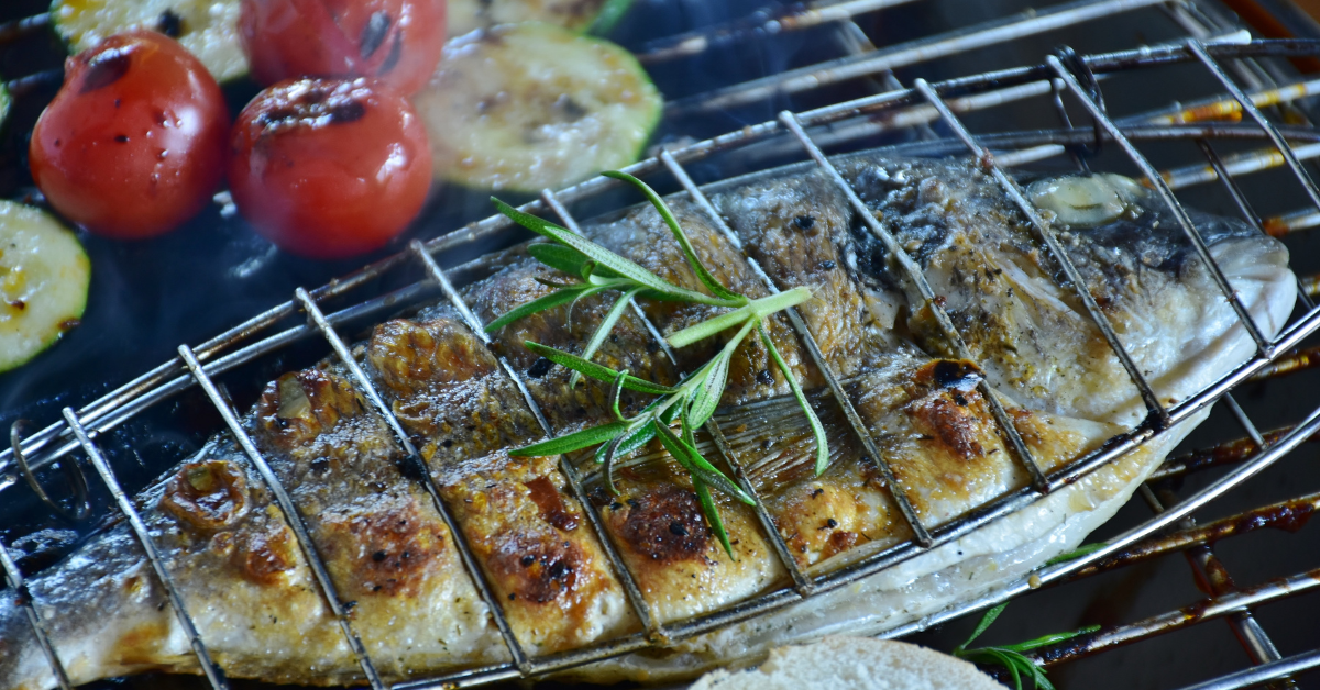 Healthy Grilled Fish and Vegetables on Grill