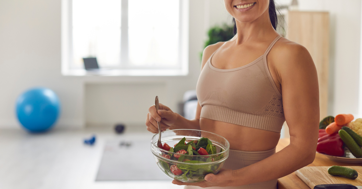patient holding salad after work out patient holding salad after work out
