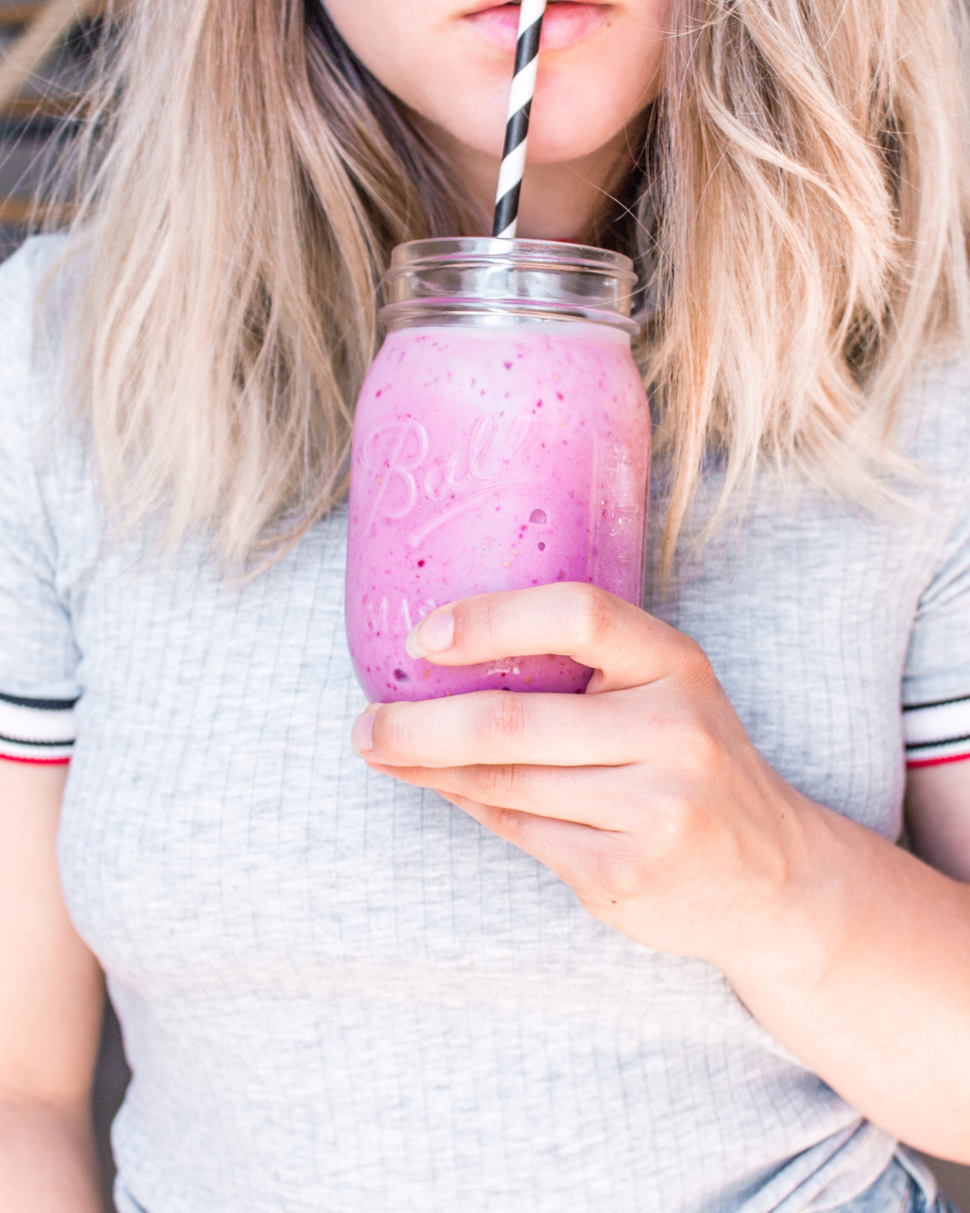 person enjoying smoothie added probiotics person enjoying a smoothie with added probiotics and prebiotics