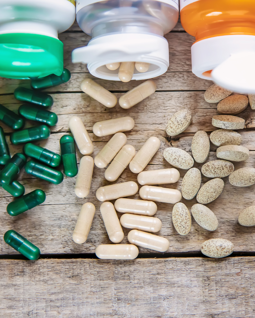 supplement bottles containing vitamins collection of supplements like magnesium, zinc, and vitamin D alongside nutrient-rich foods to support hormone health