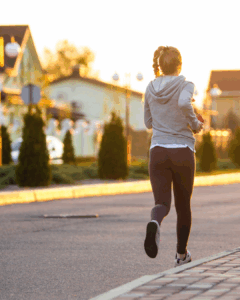 Woman jogging in her neighborhood for fitness
