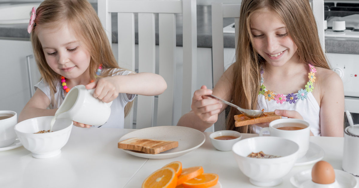 two sisters enjoying nutritious breakfast together 