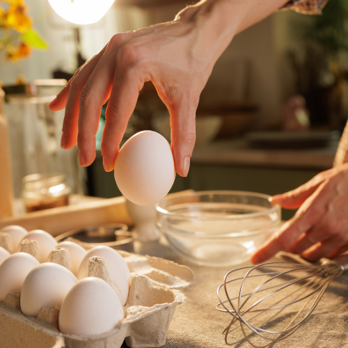 women scrambling eggs for microwavable nutritious breakfast for kids