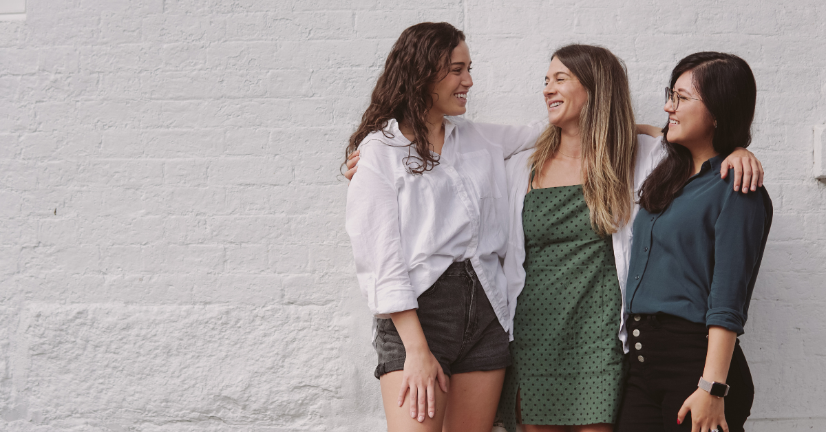 healthy women smiling hugging each other healthy women smiling and hugging each other