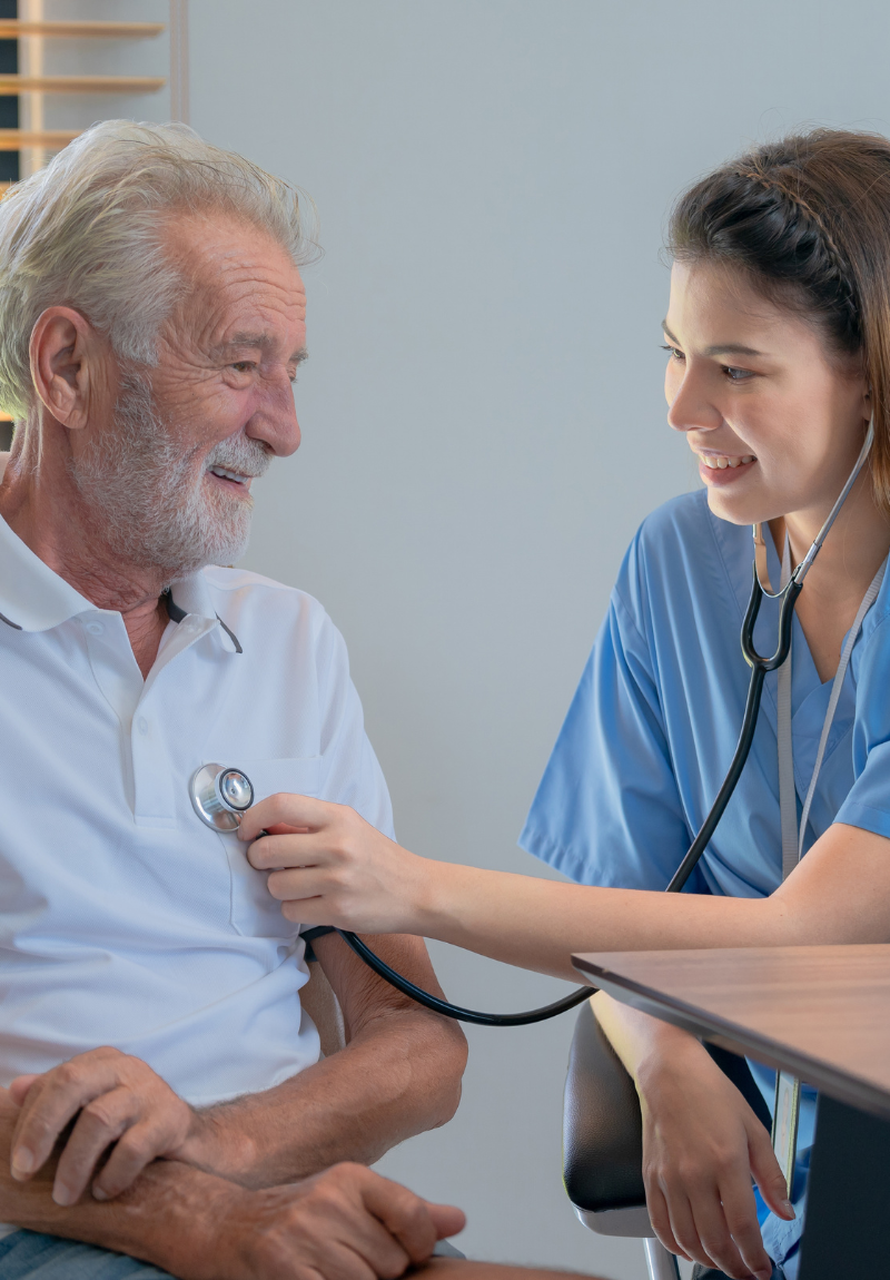 nutritionist checking old mans heart for heart health