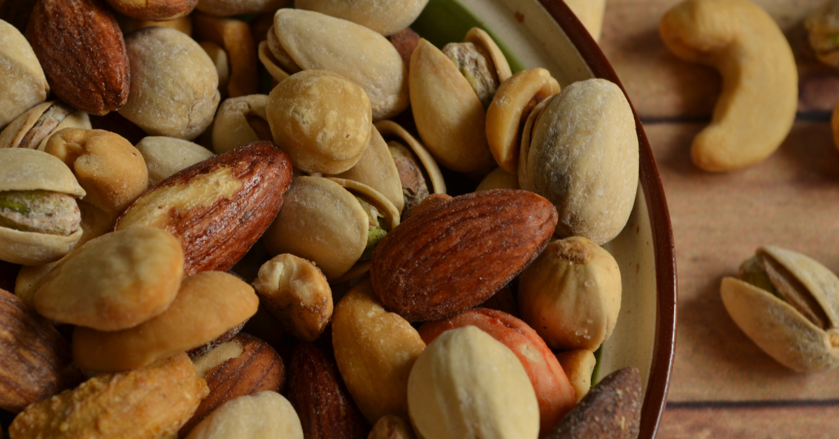 bowl of mixed nuts on a kitchen counter representing vitamin e and healthy fats for immune support