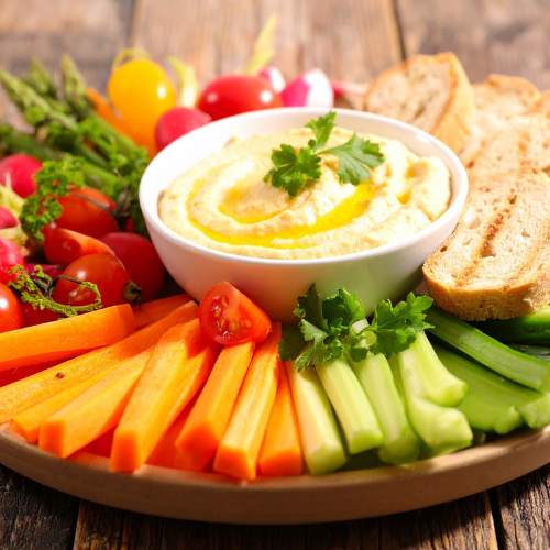 fresh fruit and vegetables with hummus