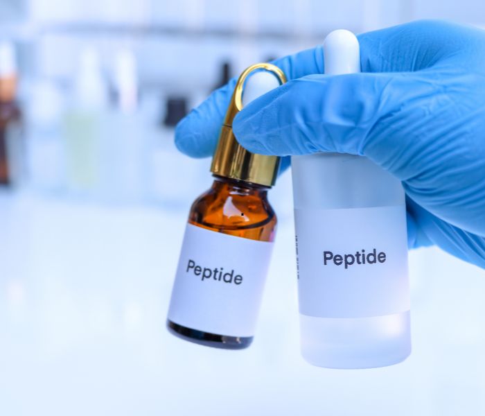 two beaker bottles with peptide labels